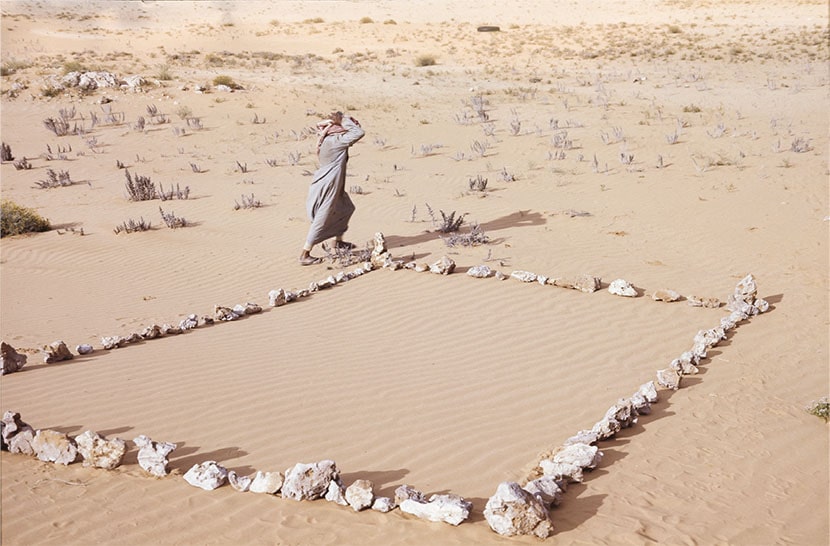 Photograph by Laura Grisi, A nomad and “his mosque” (a stone square in the desert), Saudi Arabia © Laura Grisi Estate